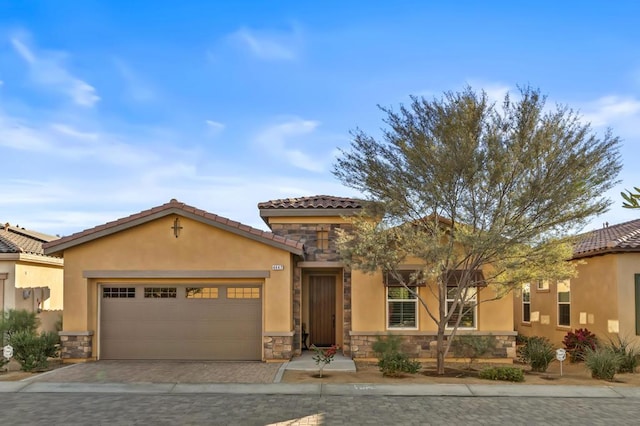 mediterranean / spanish house featuring a garage