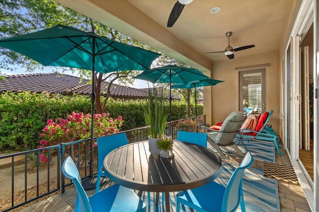 balcony featuring ceiling fan