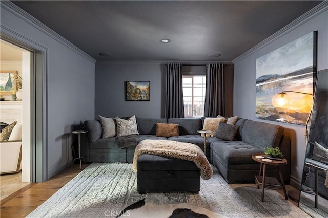 living room with light hardwood / wood-style floors and ornamental molding