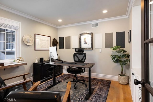 home office featuring crown molding and hardwood / wood-style flooring