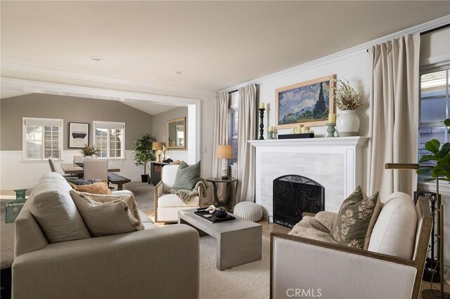 living room featuring lofted ceiling, carpet, and crown molding