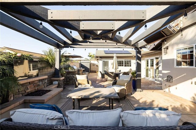 view of patio featuring an outdoor hangout area and a pergola