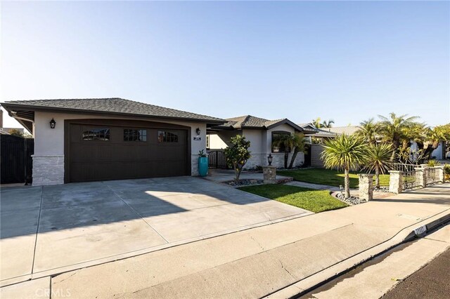 ranch-style house featuring a garage