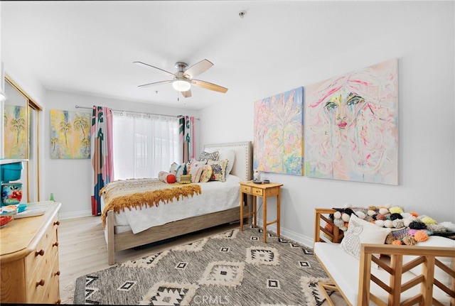 bedroom featuring ceiling fan and light hardwood / wood-style floors