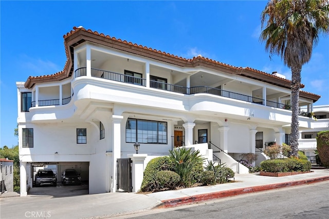 mediterranean / spanish house featuring a garage