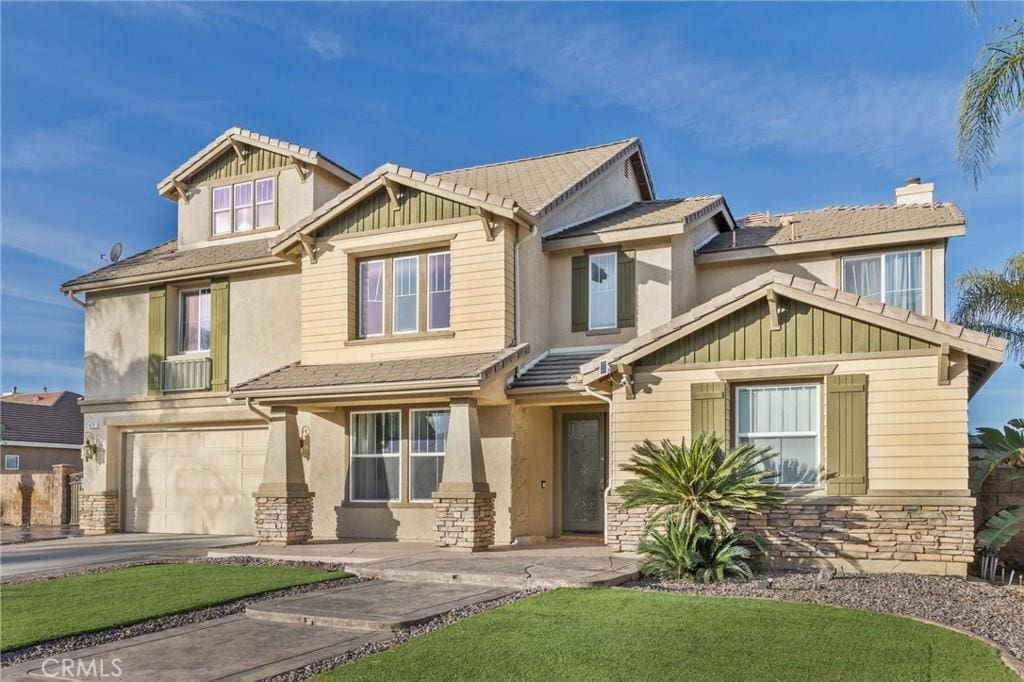 craftsman-style home with a garage