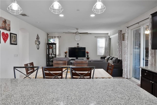 1714 Graybark Ave, Clovis, CA 93619 - dining room featuring arched walkways, ceiling fan, visible vents, and recessed lighting