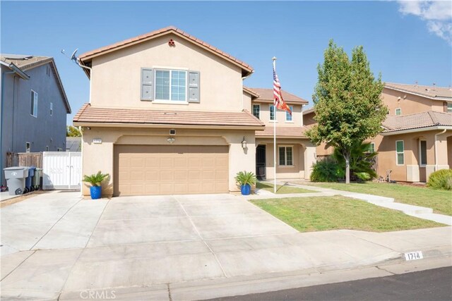 view of front facade featuring a front yard and a garage