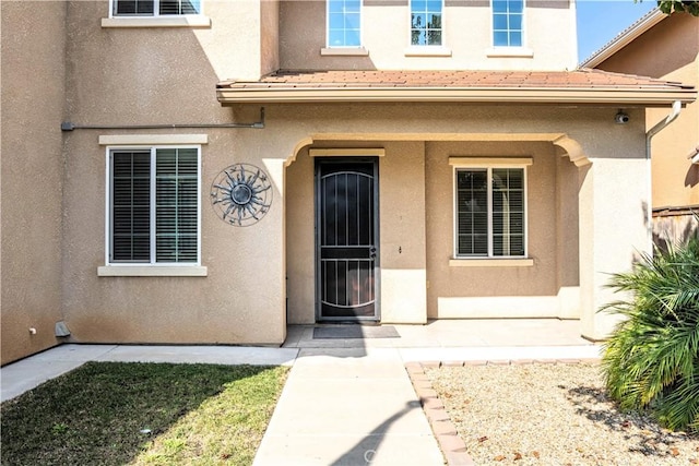 1714 Graybark Ave, Clovis, CA 93619 - entrance to property with a tiled roof and stucco siding