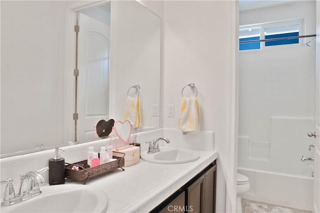 1714 Graybark Ave, Clovis, CA 93619 - bathroom with a sink, washtub / shower combination, toilet, and double vanity