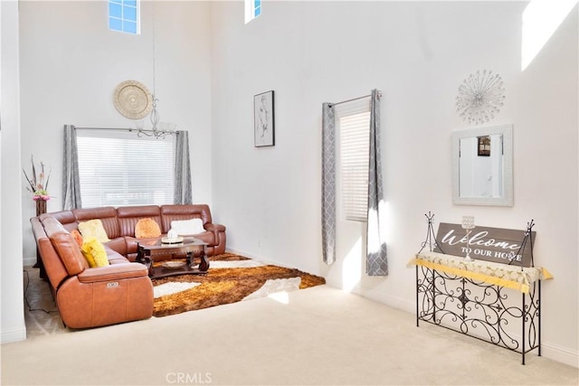 1714 Graybark Ave, Clovis, CA 93619 - carpeted living area with baseboards, a towering ceiling, and a healthy amount of sunlight
