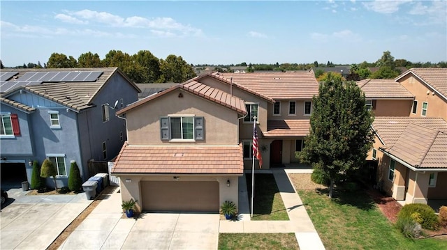 1714 Graybark Ave, Clovis, CA 93619 - view of front of home featuring a tiled roof, driveway, and stucco siding