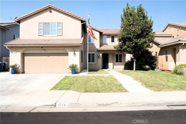 view of front of property featuring a front yard, a garage, and central AC