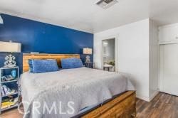 bedroom featuring dark hardwood / wood-style floors