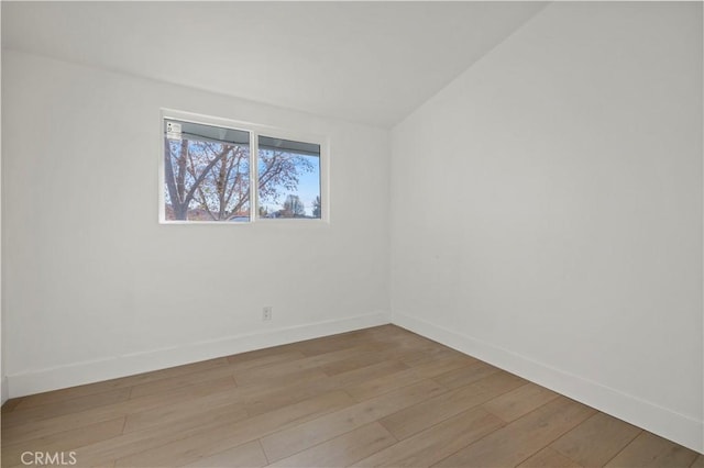 spare room featuring light wood-type flooring