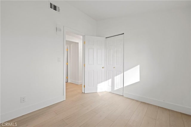 unfurnished room featuring light wood-type flooring