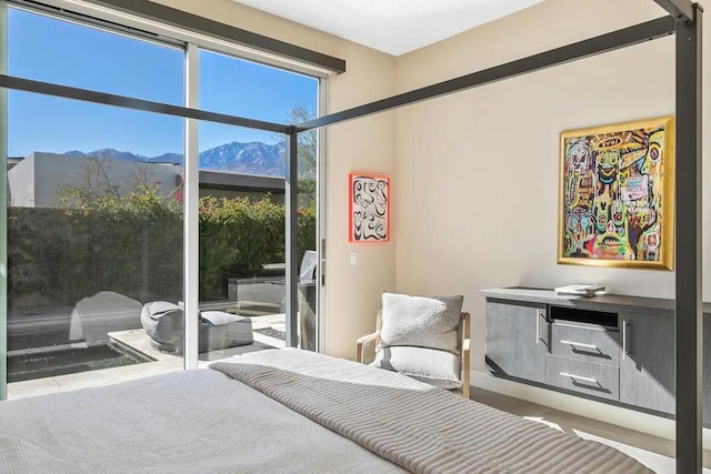 bedroom featuring a mountain view