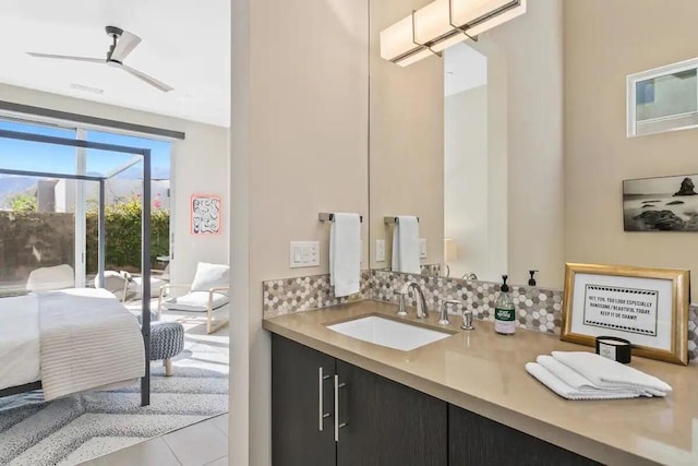 bathroom with ceiling fan, tile patterned floors, and vanity