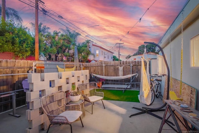 view of patio terrace at dusk