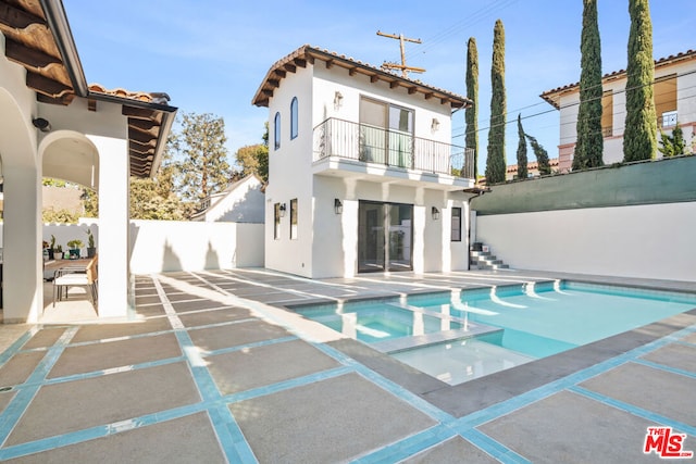 view of swimming pool featuring an in ground hot tub and a patio area