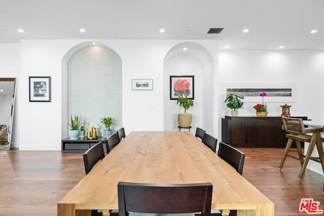 dining area featuring wood-type flooring