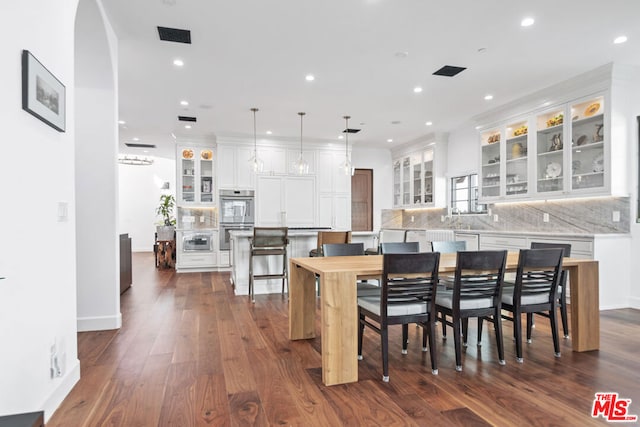 dining room with dark hardwood / wood-style flooring