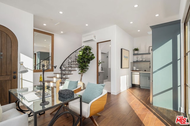 interior space with dark wood-type flooring and a wall unit AC