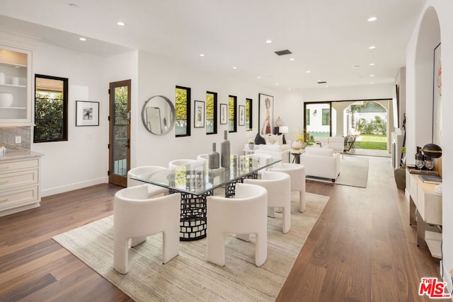 dining area with light hardwood / wood-style floors