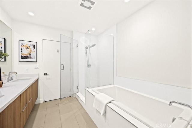 bathroom with vanity, tile patterned flooring, and independent shower and bath