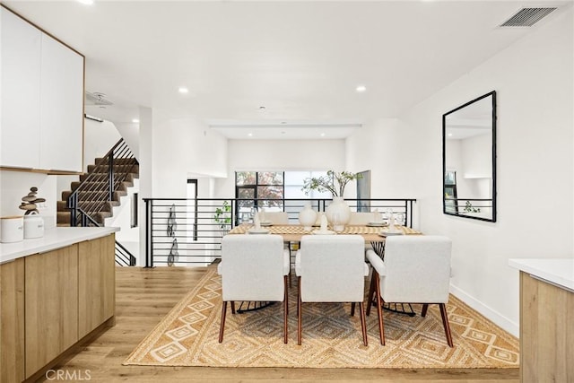 dining space featuring light hardwood / wood-style flooring