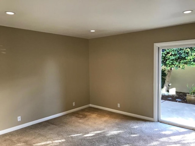 unfurnished room featuring carpet flooring