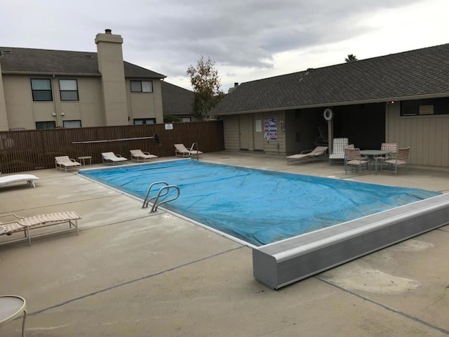 view of swimming pool with a patio area