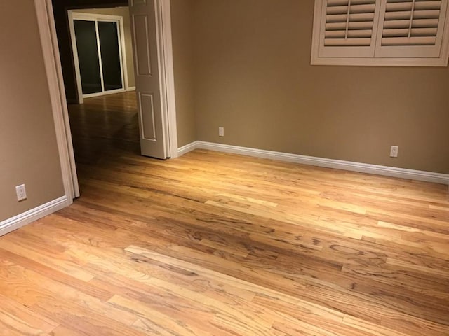 spare room with light hardwood / wood-style flooring