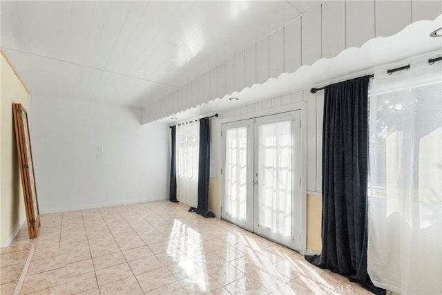 unfurnished room with french doors