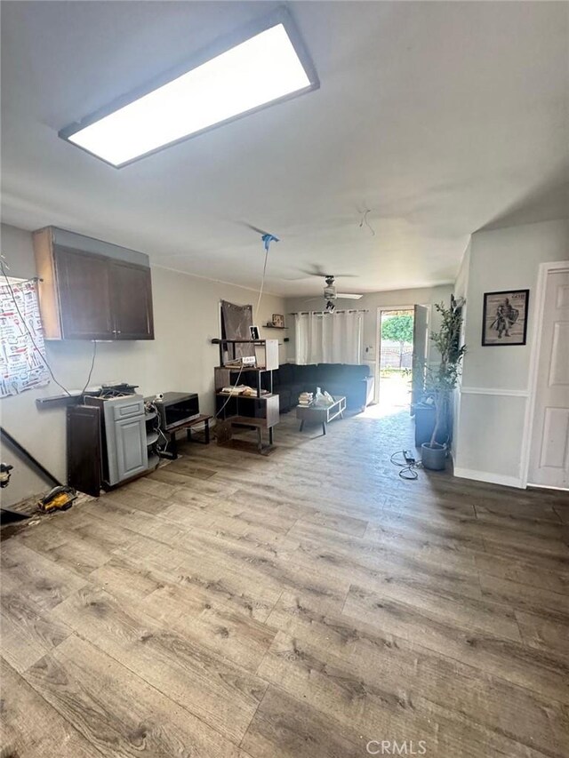 interior space featuring light wood-type flooring and ceiling fan