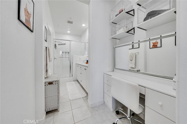 bathroom with tile patterned floors, an enclosed shower, and vanity