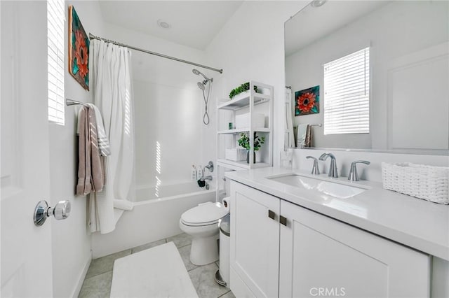 full bathroom featuring toilet, tile patterned floors, vanity, and shower / bath combo with shower curtain