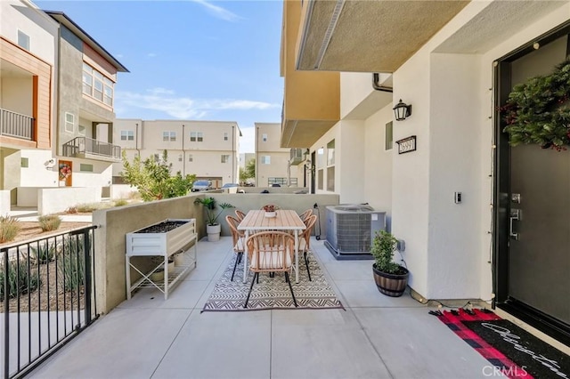 balcony featuring cooling unit and a patio area