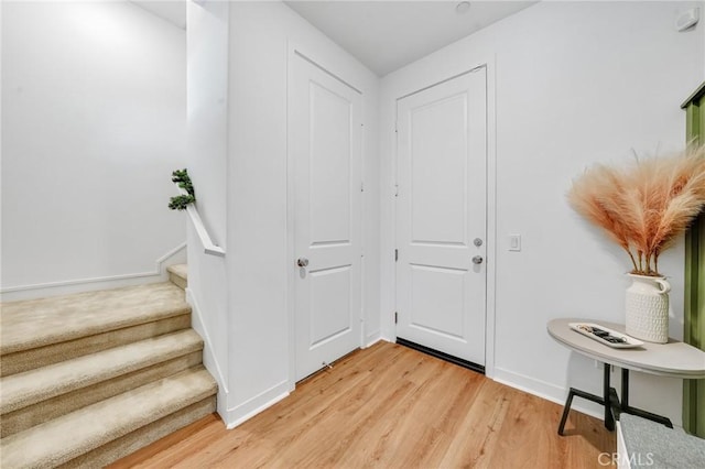 entryway with light hardwood / wood-style flooring