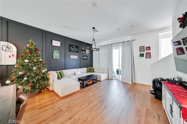 living room with a wealth of natural light and hardwood / wood-style floors