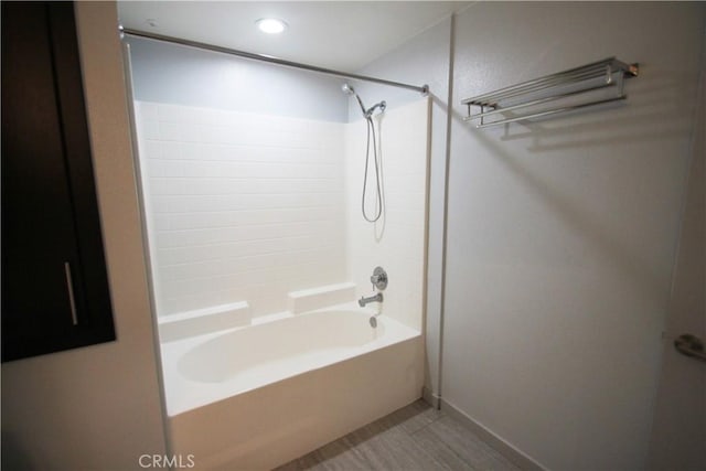 bathroom with shower / washtub combination