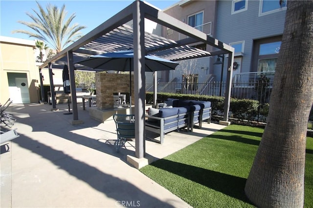 view of property's community with a pergola, outdoor lounge area, a yard, and a patio