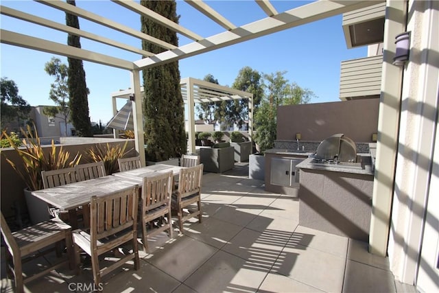 view of patio featuring sink, a grill, area for grilling, and a pergola