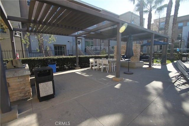 view of community featuring a patio and a pergola