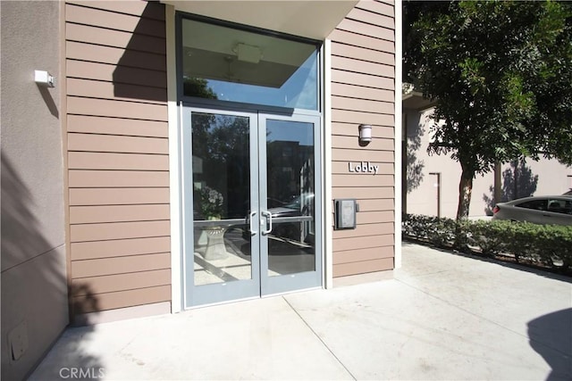 property entrance featuring french doors