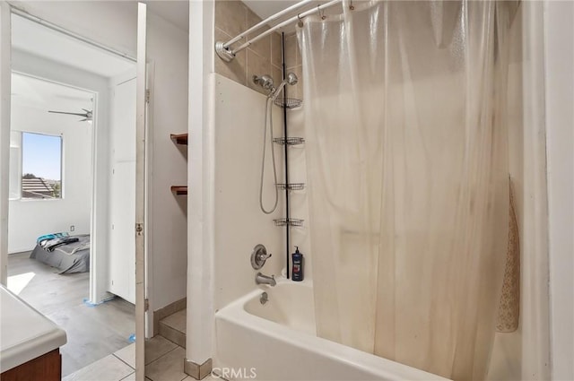 bathroom with ceiling fan, shower / tub combo, and vanity