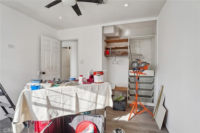 dining room with dark hardwood / wood-style flooring and ceiling fan