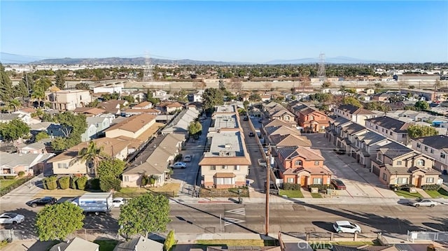 birds eye view of property with a mountain view