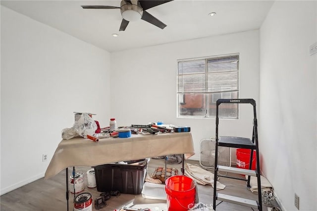 home office with ceiling fan and hardwood / wood-style flooring