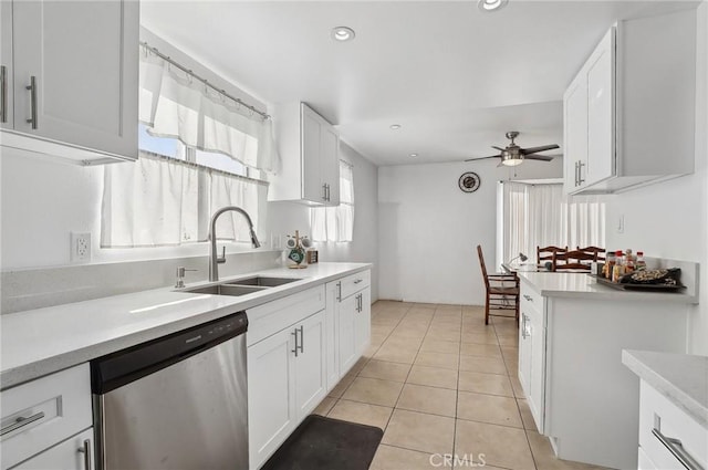 kitchen featuring sink, ceiling fan, white cabinetry, and stainless steel dishwasher